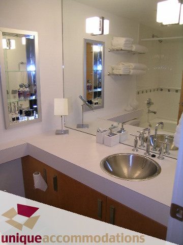Furnished bathroom with modern sink, countertop, and mirror. - 211- 1216 Homer, Vancouver Downtown