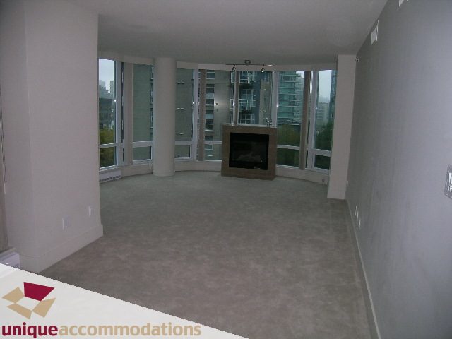 Spacious living room with large windows and city view. - 506 - 590 Nicola Street, Vancouver Downtown