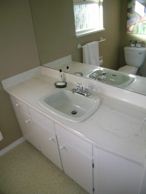 Spacious bathroom with white countertop and modern sink, perfect for a cozy stay. - 3554 St. Andrews Avenue, North Vancouver
