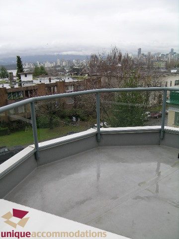 Furnished balcony with city view and greenery. - 408-2250 West 3rd Avenue, Vancouver West Side