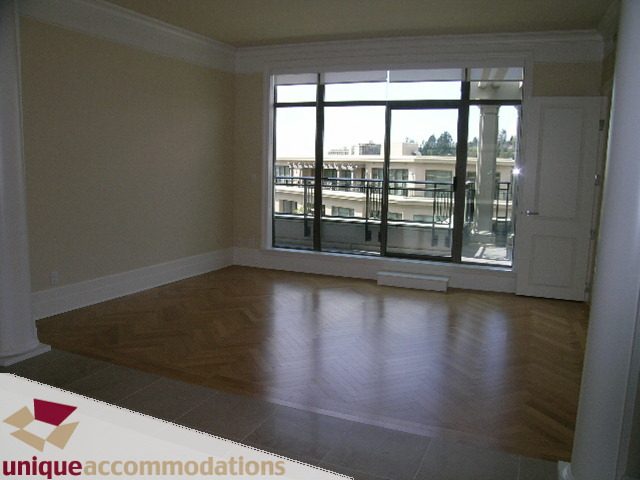 Bright living room with hardwood floors and city view. - PH1 - 508 Waters Edge Cres., West Vancouver