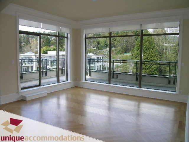 Bright living room with hardwood floors and a city view. - PH1 - 508 Waters Edge Cres., West Vancouver