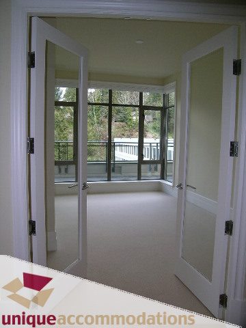 Spacious living room with large windows and city view. - PH1 - 508 Waters Edge Cres., West Vancouver