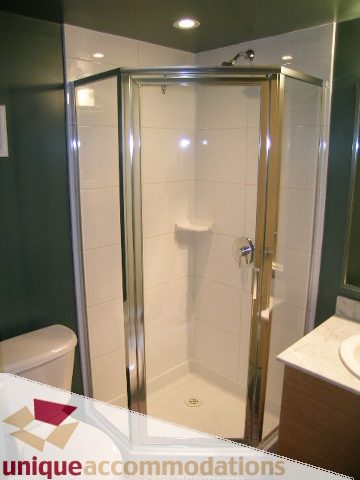 Furnished bathroom with modern shower and white countertops. - 2314 - 938 Smithe Street, Vancouver Downtown
