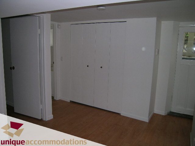 Furnished den with white closet doors and hardwood floors. - 1428 29th Street, West Vancouver