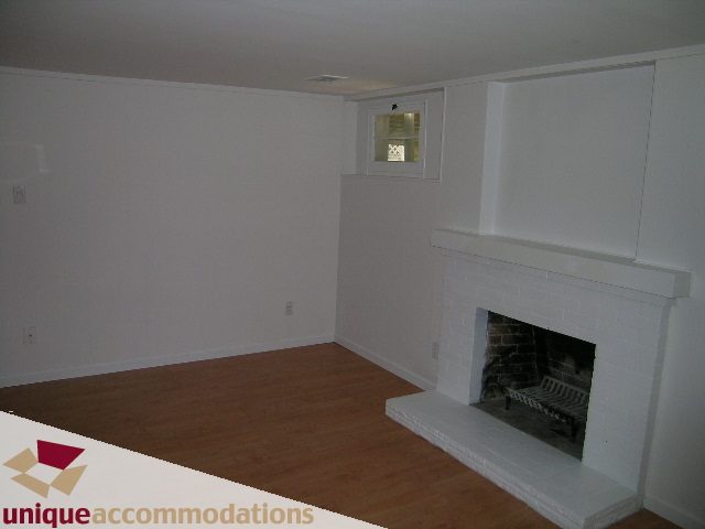 Living room with hardwood floors and a fireplace. - 1428 29th Street, West Vancouver