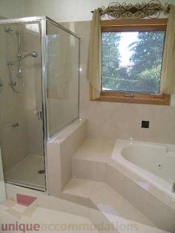 Bathroom with walk-in shower and window view. - 4215 Evergreen Ave, West Vancouver