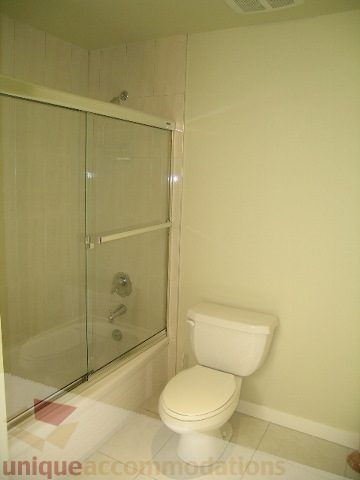 Bathroom with glass shower and toilet. - 4215 Evergreen Ave, West Vancouver