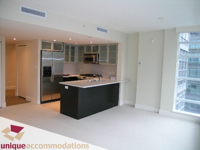 Bright kitchen with stainless steel appliances and city view. - 1805 -1205 W Hastings, Vancouver Downtown