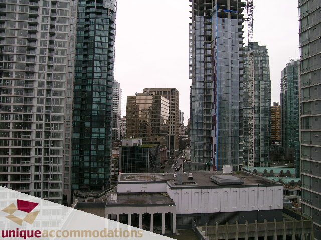 Furnished 1-bedroom condo with stunning city view, high-rise buildings in the background. - 1805 -1205 W Hastings, Vancouver Downtown