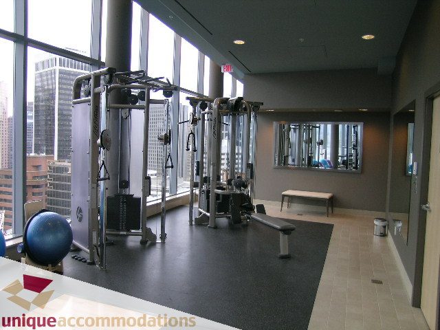 Bright gym with city view and modern equipment. - 1805 -1205 W Hastings, Vancouver Downtown