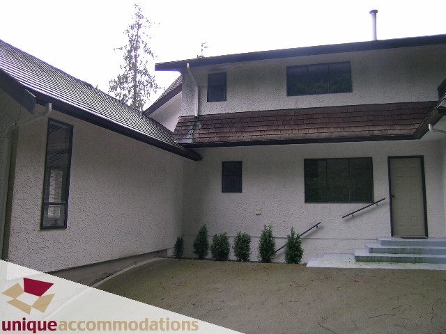 Spacious courtyard with modern design and large windows. - 5568 Greenleaf Road, West Vancouver