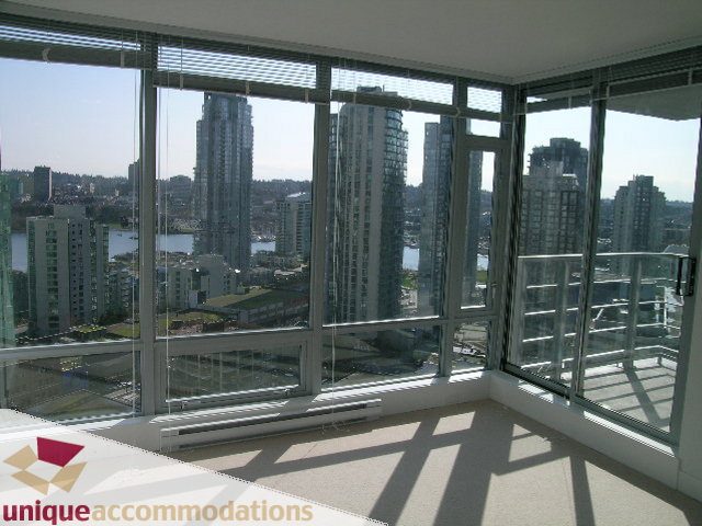 Bright living room with large windows, city view, and modern furnishings. - 2002 - 1255 Seymour, Vancouver Downtown