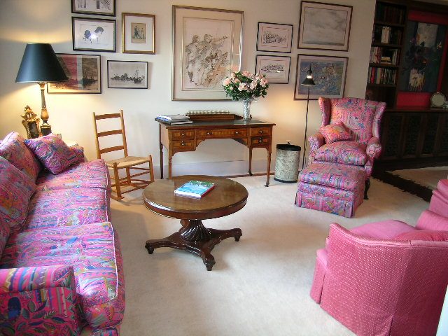 Bright living room with colorful patterned furniture and wall art, cozy and inviting. - 1152 West 7th Ave, Vancouver West Side
