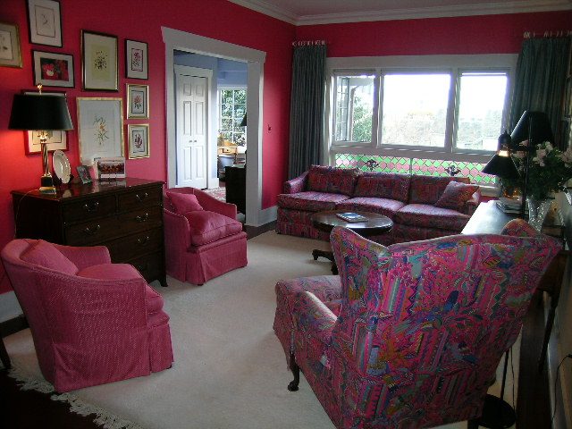 Furnished living room with vibrant pink walls, patterned furniture, and large windows. - 1152 West 7th Ave, Vancouver West Side