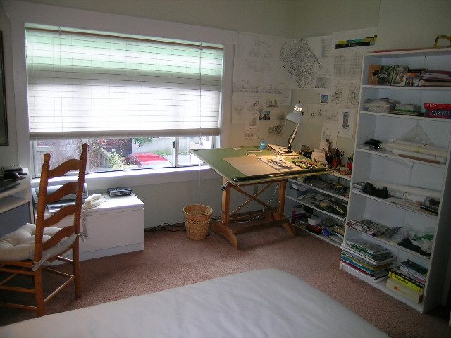 Bright bedroom with desk, shelves, and large window, perfect for studying or working. - 1152 West 7th Ave, Vancouver West Side
