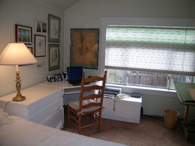 Bright bedroom with white countertops and framed artwork, natural light from window. - 1152 West 7th Ave, Vancouver West Side
