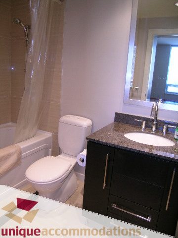 Bright bathroom with granite countertops and a city view. - 1905 - 638 Beach Cres, Vancouver Downtown