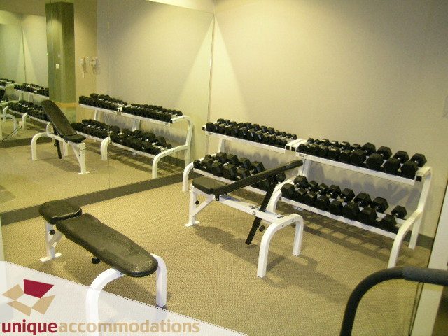 Fitness room with weight benches and dumbbells. - 1905 - 638 Beach Cres, Vancouver Downtown
