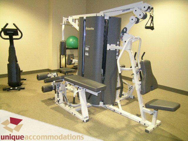 Fitness room with weight machines and cardio equipment. - 1905 - 638 Beach Cres, Vancouver Downtown