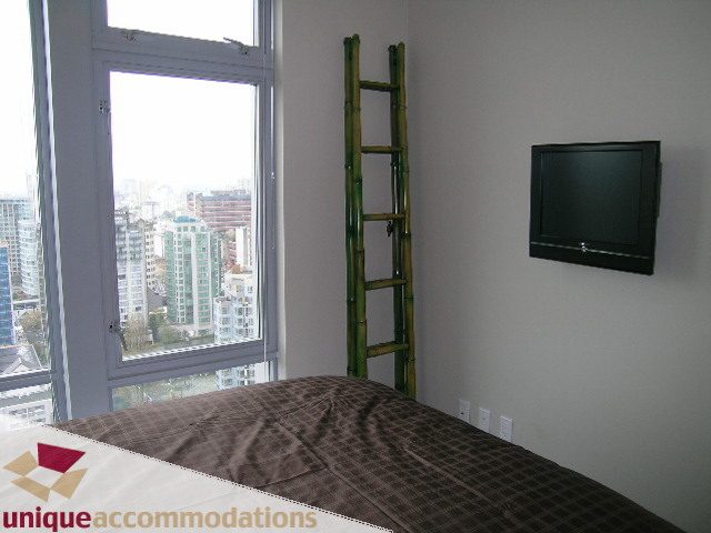 Bright bedroom with city view and bamboo ladder. - 3104 - 1255 Seymour Street, Vancouver Downtown