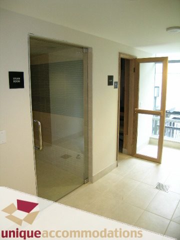 Bright bathroom with glass shower and large window. - 3104 - 1255 Seymour Street, Vancouver Downtown