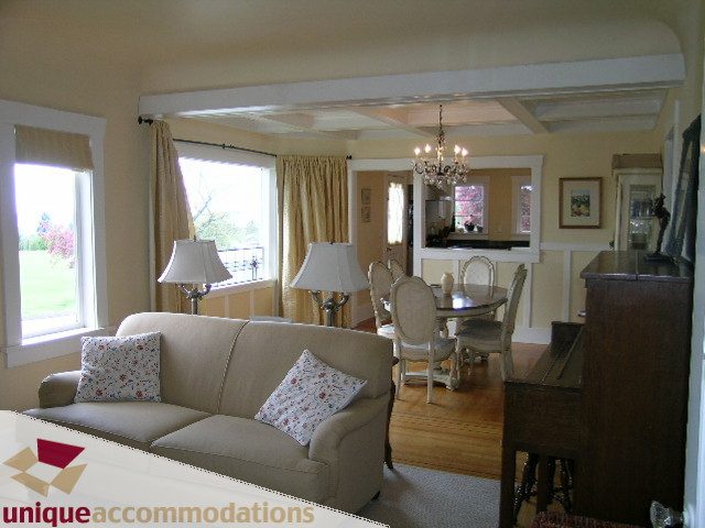 Spacious living room with hardwood floors and a view of the garden. - 1505 Grand Blvd., North Vancouver