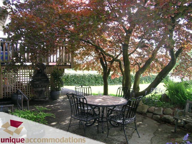Furnished patio with red maple trees and outdoor furniture. - 1505 Grand Blvd., North Vancouver
