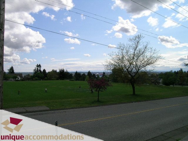 Furnished living room with greenery and a scenic view. - 1505 Grand Blvd., North Vancouver