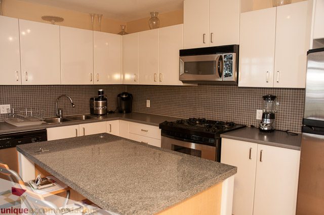 Bright kitchen with granite countertops and stainless steel appliances. - 508-155 West 1st Street, North Vancouver