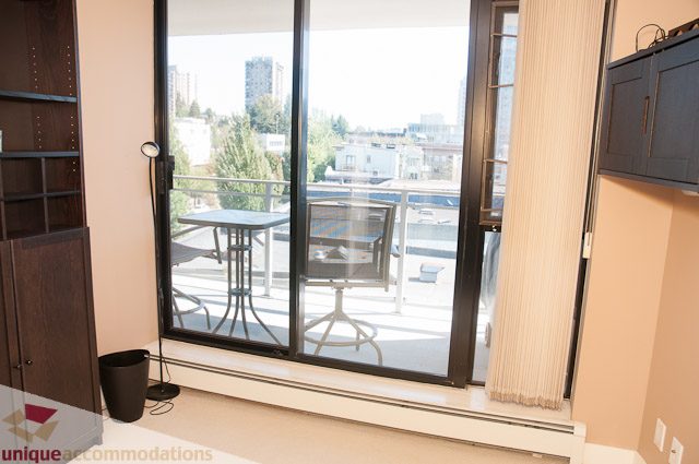 Bright living room with city view and modern furnishings. - 508-155 West 1st Street, North Vancouver