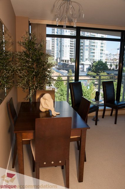Furnished dining area with city view and modern decor. - 508-155 West 1st Street, North Vancouver