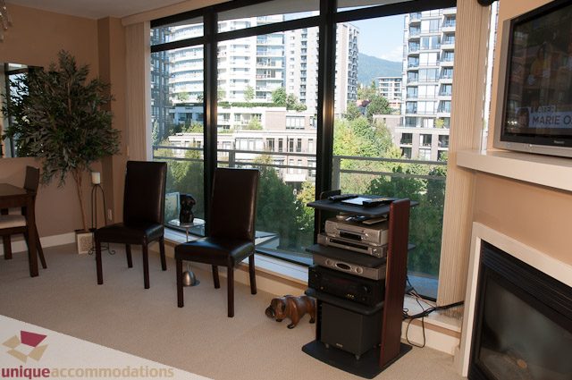 Spacious living room with city view and modern furnishings. - 508-155 West 1st Street, North Vancouver