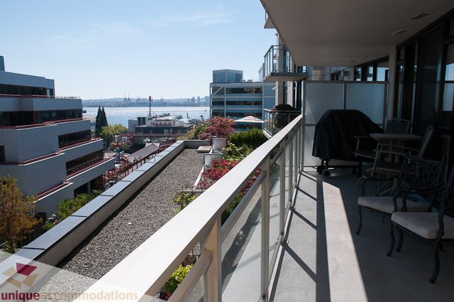 Furnished balcony with city view and outdoor seating. - 508-155 West 1st Street, North Vancouver