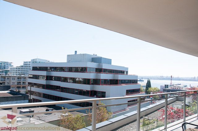 Furnished balcony with city view and modern architecture. - 508-155 West 1st Street, North Vancouver