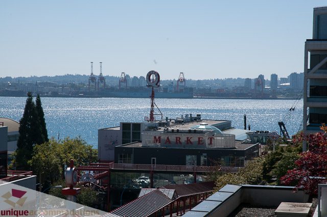 Spacious living room with a stunning city view and waterfront access. - 508-155 West 1st Street, North Vancouver
