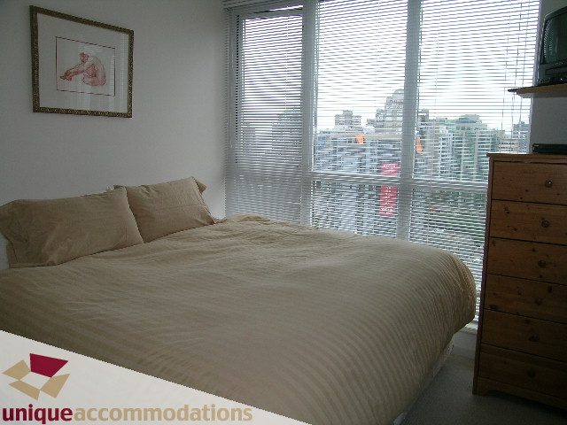 Furnished 1-bedroom + den with city view and wooden furniture. - 2001-1199 Seymour Street, Vancouver Downtown