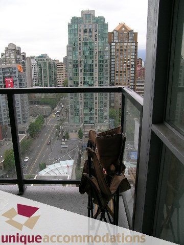 Furnished balcony with city view and modern furnishings. - 2001-1199 Seymour Street, Vancouver Downtown