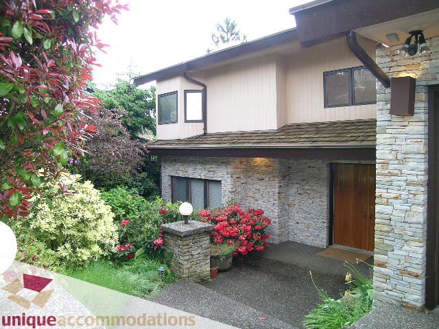 Furnished 6-bedroom + den suite with stone accents and lush garden view. - 1472 Camridge Road, West Vancouver