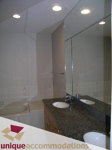 Furnished bathroom with granite countertop and modern lighting. - 1472 Camridge Road, West Vancouver