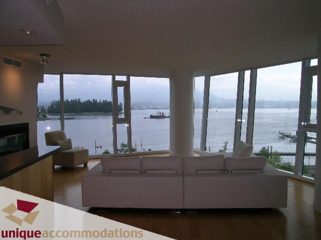 Living room with large windows, hardwood floors, and a stunning city view. - 502 - 1233 W. Cordova Street, Vancouver Downtown