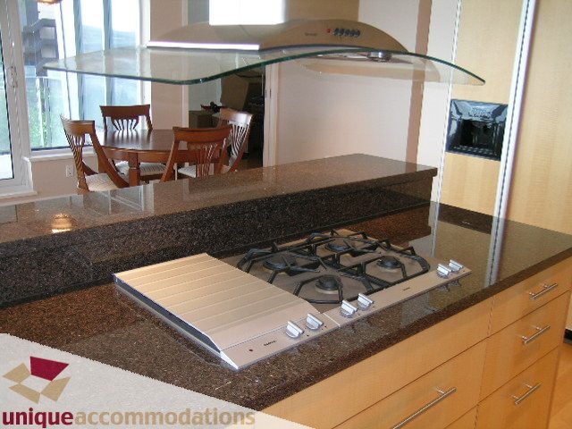 Bright kitchen with granite countertops and stainless steel appliances, modern design. - 502 - 1233 W. Cordova Street, Vancouver Downtown