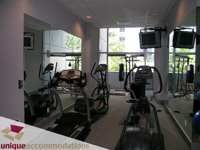 Furnished gym with cardio machines, large windows, and city view. - 502 - 1233 W. Cordova Street, Vancouver Downtown