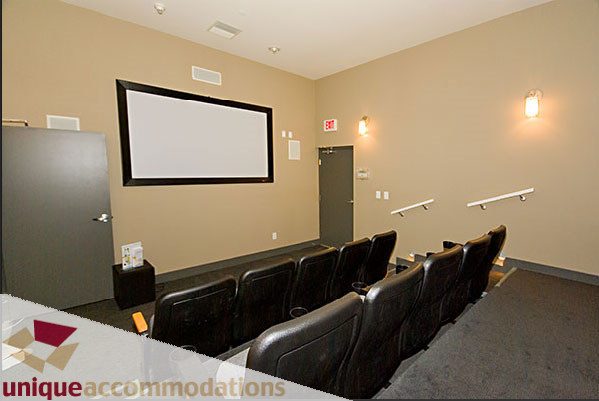 Bright home theater with leather seats and projector screen. - 801- 628 Kinghorne Mews, Vancouver Downtown