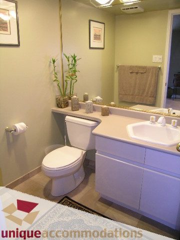 Furnished bathroom with modern sink, bamboo decor, and light-colored countertops. - 802-1590 West 8th Ave, Vancouver West Side