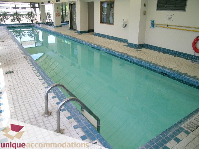 Spacious indoor pool with tiled edges and handrails. - 802-1590 West 8th Ave, Vancouver West Side