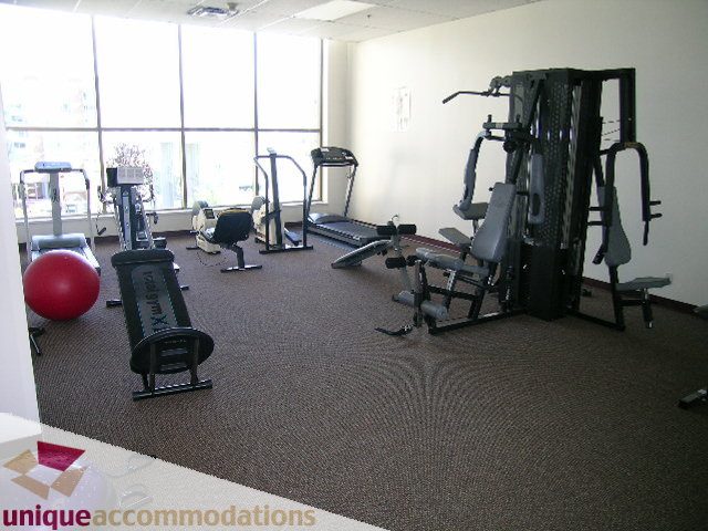 Bright and spacious gym with cardio equipment and weight machines. - 802-1590 West 8th Ave, Vancouver West Side