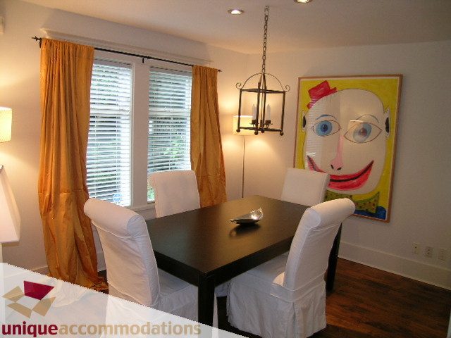 Dining area with modern decor, artwork, and hardwood floors. - 1815 Creelman Avenue, Vancouver West Side