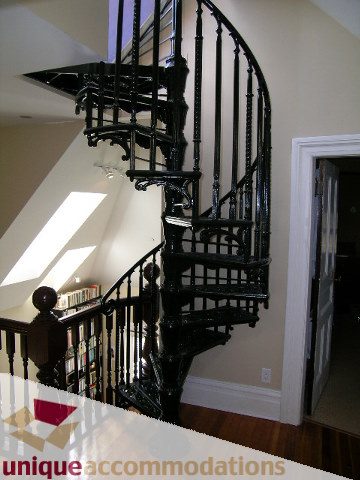 Furnished suite with spiral staircase and hardwood floors. - 995 Bute Street "Rand House", Vancouver Downtown