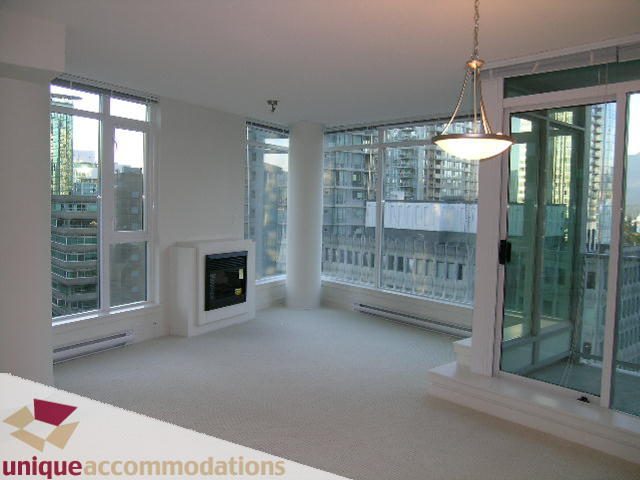 Spacious living room with large windows, city view, and modern decor. - 1101 - 1188 West Pender, Vancouver Downtown